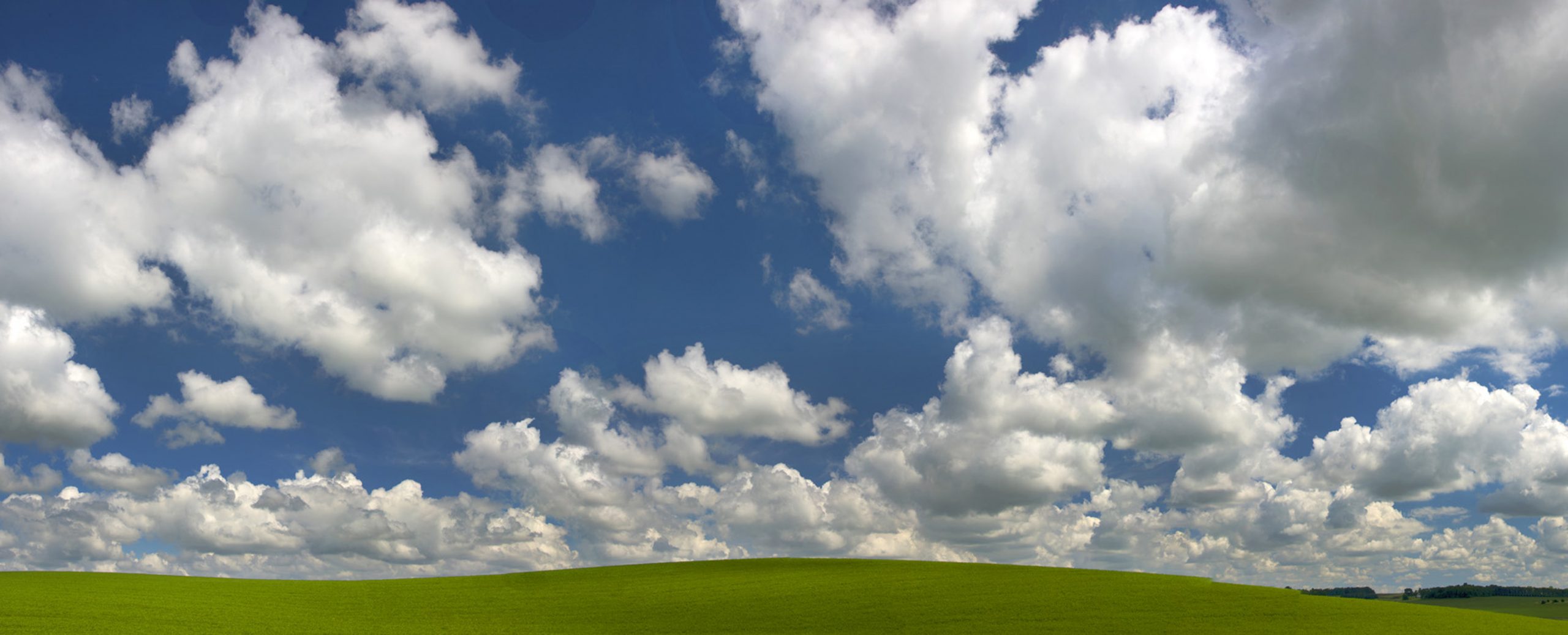 Puffy white clouds drifting above green grass is a great visual of how to pray