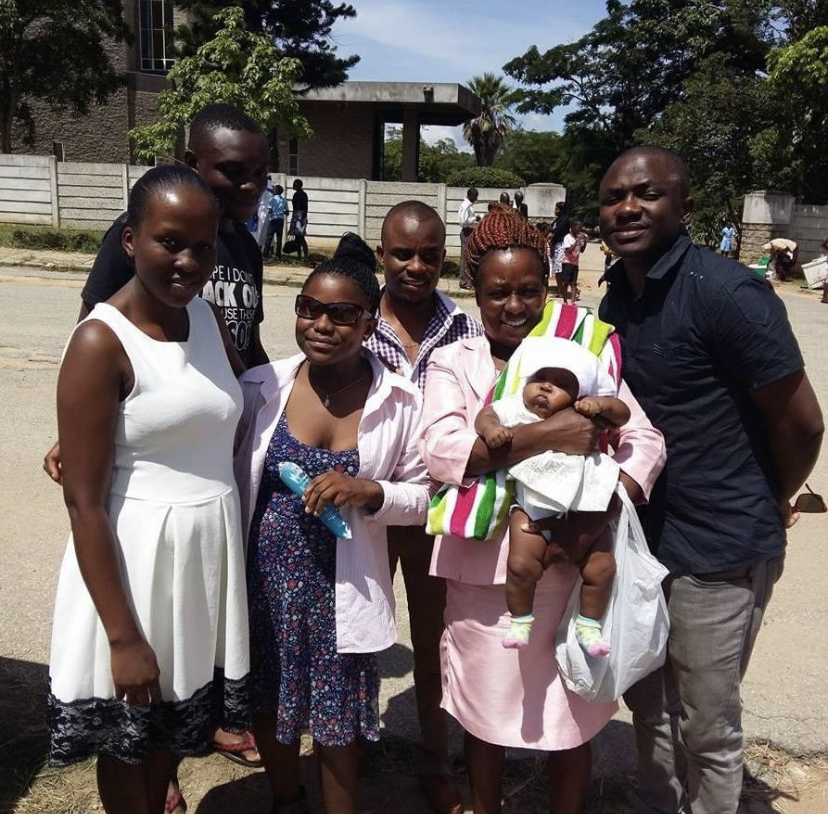 Wadzanayi Mayiseni, bone cancer survivor, and her six family members from Zimbabwe