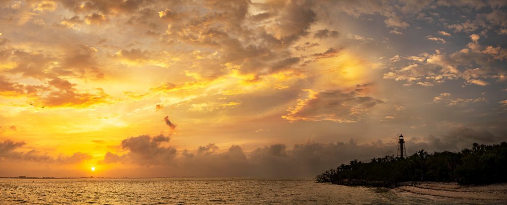 A yellow and orange sunset paints the coast of Sanibel Island, reminding us of prayer