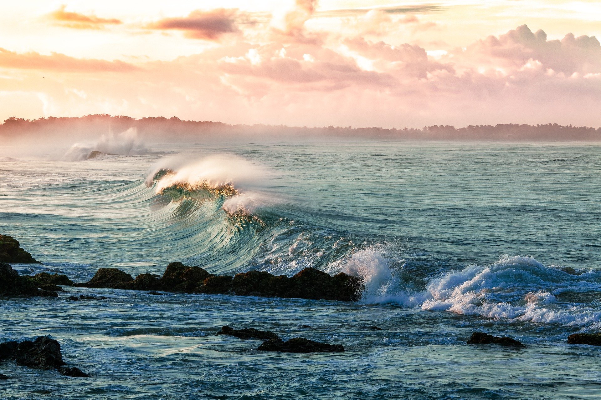 waves wash up on a rocky shore like emotions of a cancer journey
